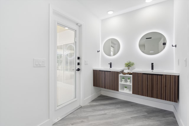 bathroom with vanity and hardwood / wood-style floors