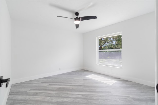 empty room with light hardwood / wood-style flooring and ceiling fan