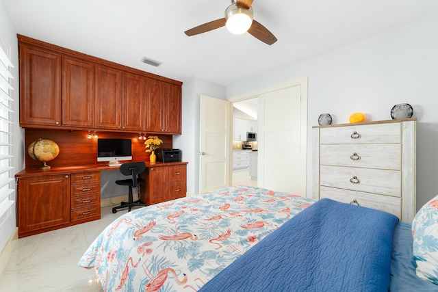 bedroom featuring ceiling fan and built in desk