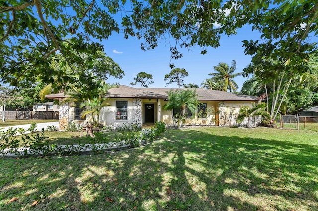 single story home with a front lawn