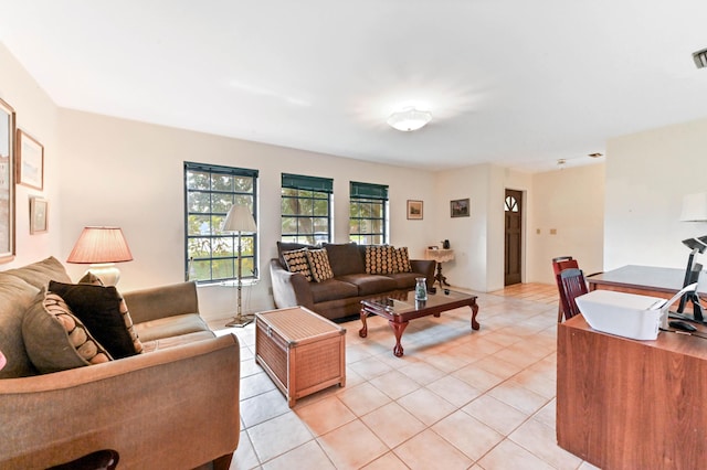 living room with visible vents and light tile patterned floors