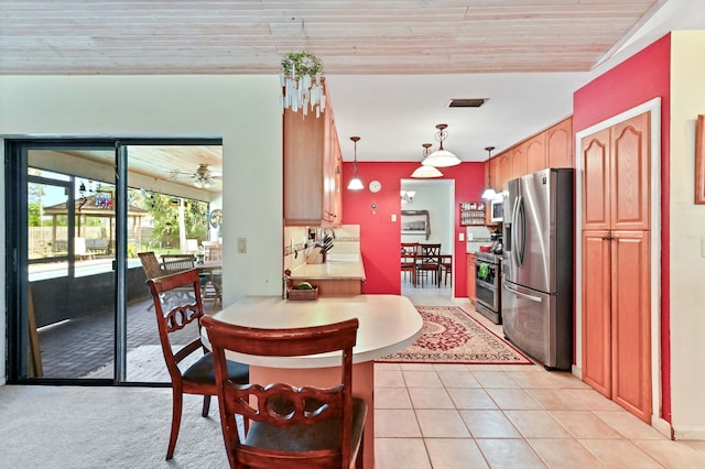 dining space with wood ceiling, visible vents, and light tile patterned floors