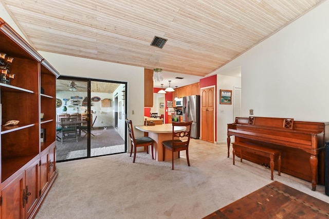 dining space with visible vents, light colored carpet, ceiling fan, and wooden ceiling