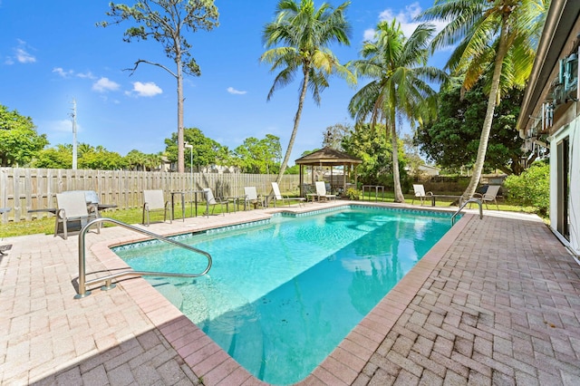 view of swimming pool with a fenced backyard, a gazebo, a patio, and a fenced in pool