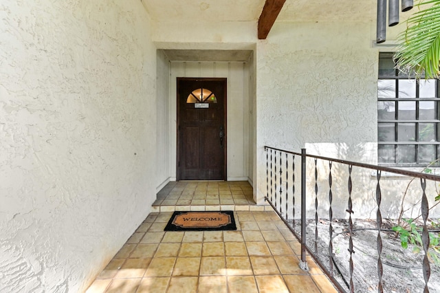 entrance to property with stucco siding