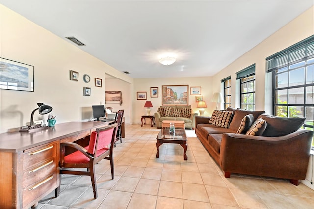 living room with visible vents and light tile patterned floors