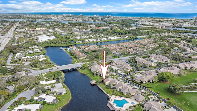 birds eye view of property featuring a water view