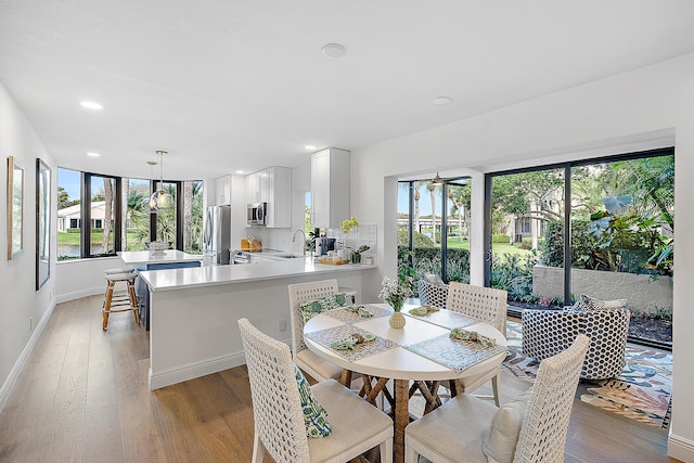 dining area with light wood-type flooring