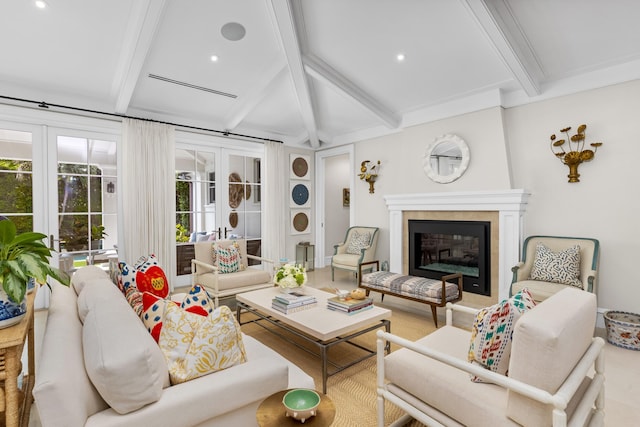 living room with beam ceiling and french doors