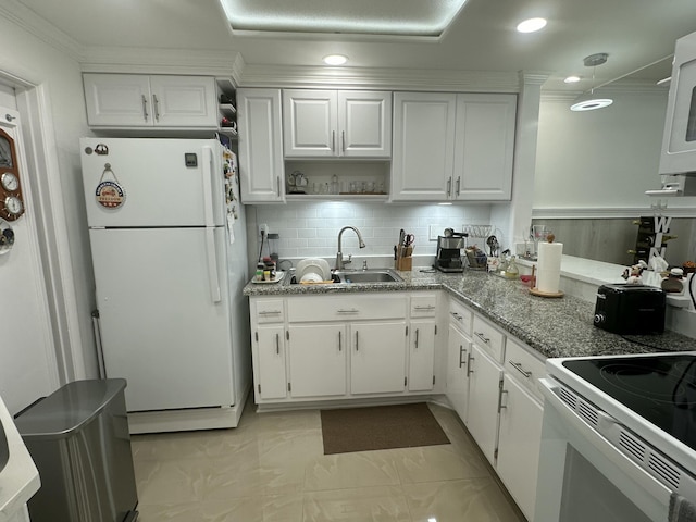 kitchen with white cabinetry, white appliances, sink, and light stone counters