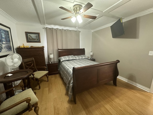 bedroom with ornamental molding, a textured ceiling, ceiling fan, and light hardwood / wood-style flooring