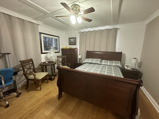 bedroom featuring crown molding, ceiling fan, a textured ceiling, and light hardwood / wood-style floors