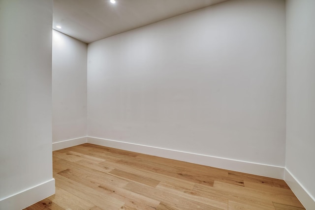 unfurnished room with hardwood / wood-style floors