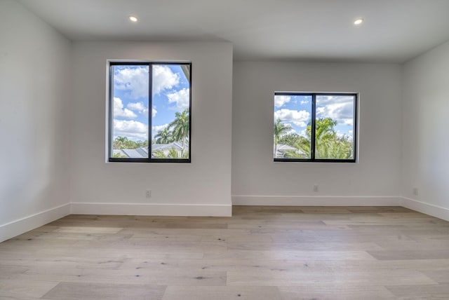 spare room with light wood-type flooring