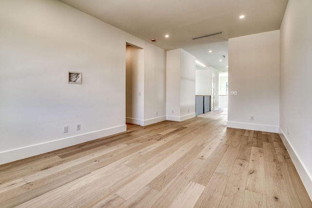 spare room featuring light hardwood / wood-style floors