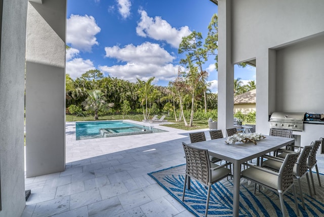 view of swimming pool featuring area for grilling, a grill, and a patio