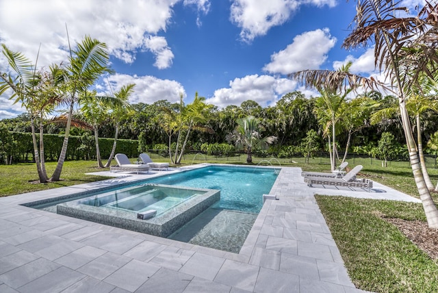 view of swimming pool featuring a yard, a patio, and an in ground hot tub