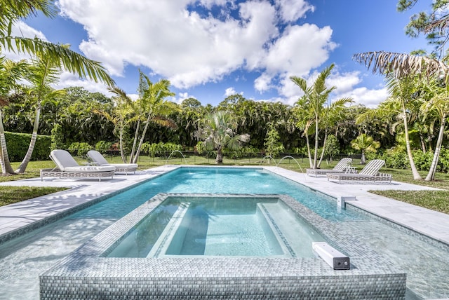 view of swimming pool featuring an in ground hot tub and pool water feature