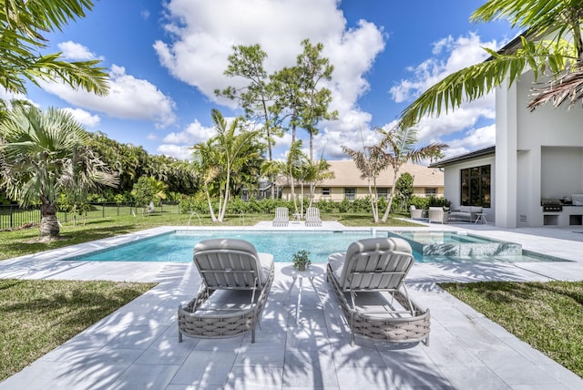 view of pool with an outdoor living space, a patio, and a lawn