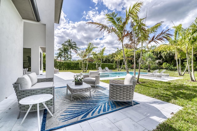 view of patio featuring a fenced in pool and an outdoor hangout area