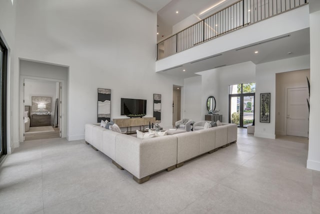 living room featuring a high ceiling