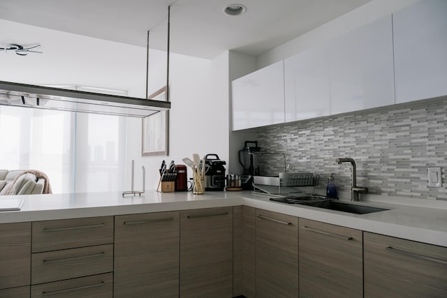 kitchen with sink and decorative backsplash