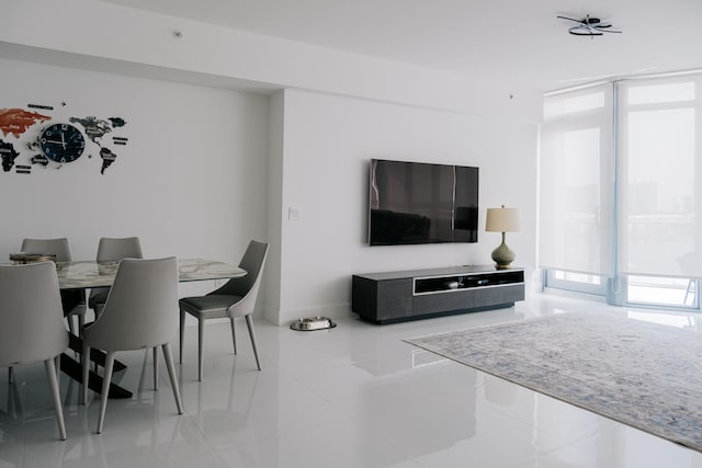 living room featuring a wall of windows