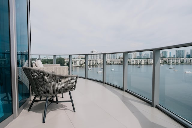 balcony featuring a water view