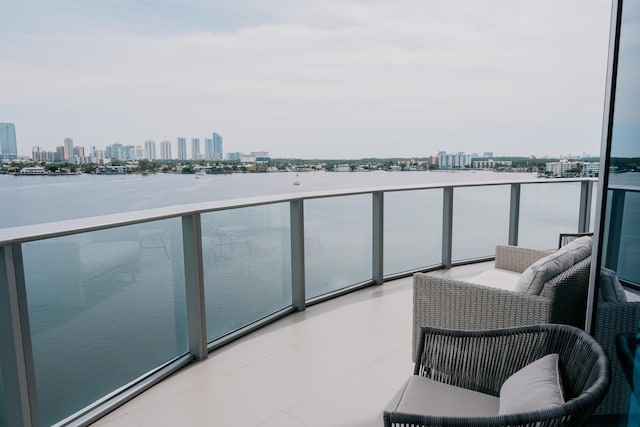 balcony featuring a water view