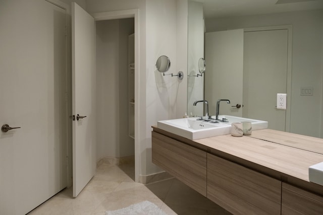 bathroom featuring tile patterned floors and vanity