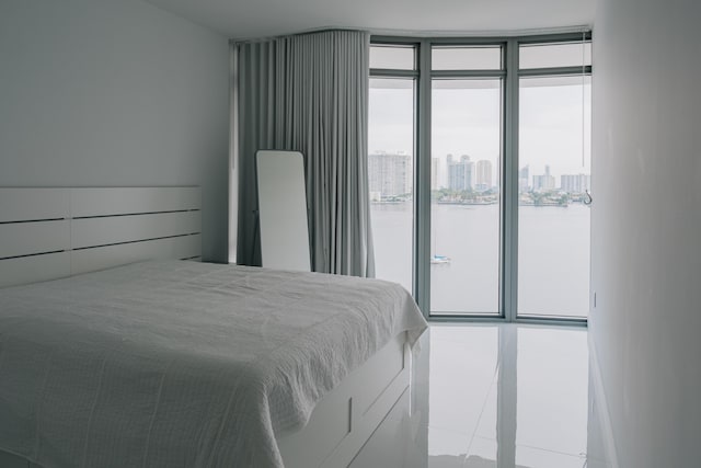 bedroom featuring a water view