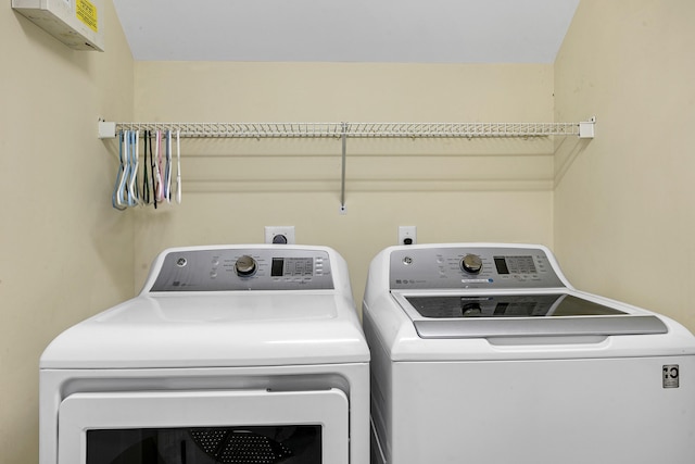 laundry room featuring washing machine and clothes dryer