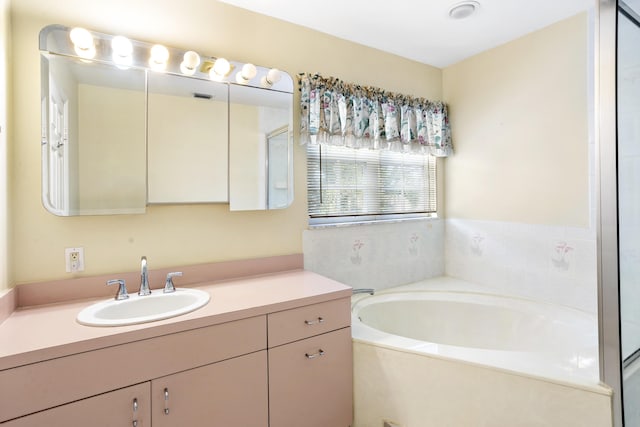 bathroom featuring vanity and a bathing tub