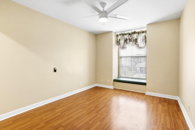 unfurnished room featuring hardwood / wood-style flooring, a textured ceiling, and ceiling fan