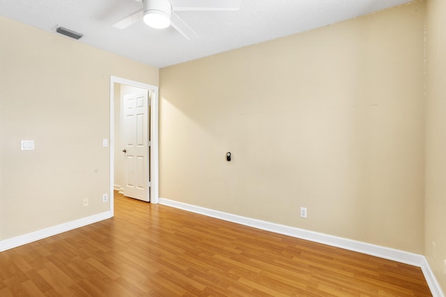 unfurnished room with ceiling fan and wood-type flooring