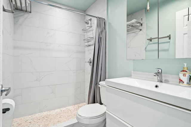 bathroom with vanity, toilet, and a shower with shower curtain