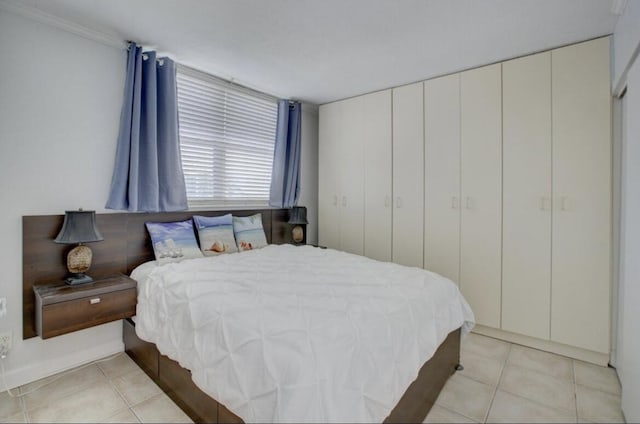 bedroom featuring light tile patterned floors