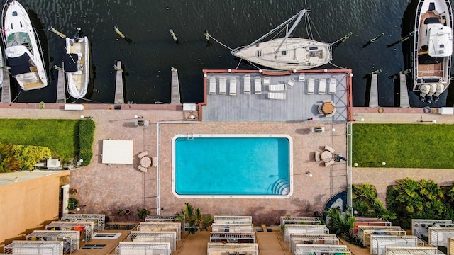 view of pool with a water view