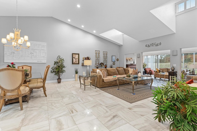 living area with baseboards, high vaulted ceiling, a notable chandelier, and recessed lighting