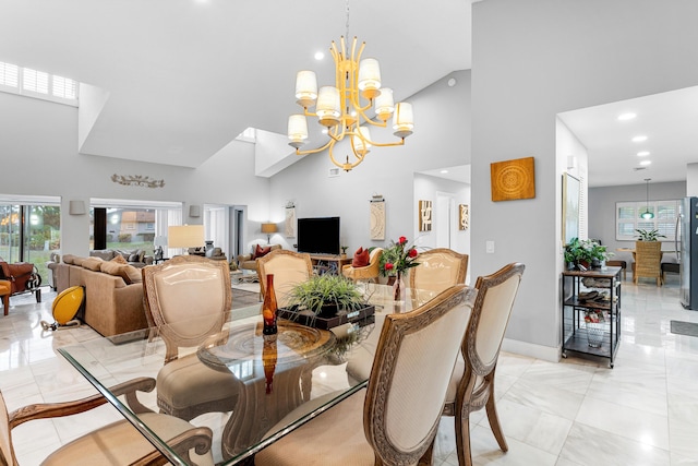 dining space with high vaulted ceiling, recessed lighting, a notable chandelier, and baseboards