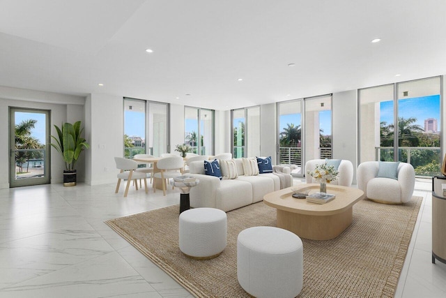 living area with floor to ceiling windows, plenty of natural light, and recessed lighting