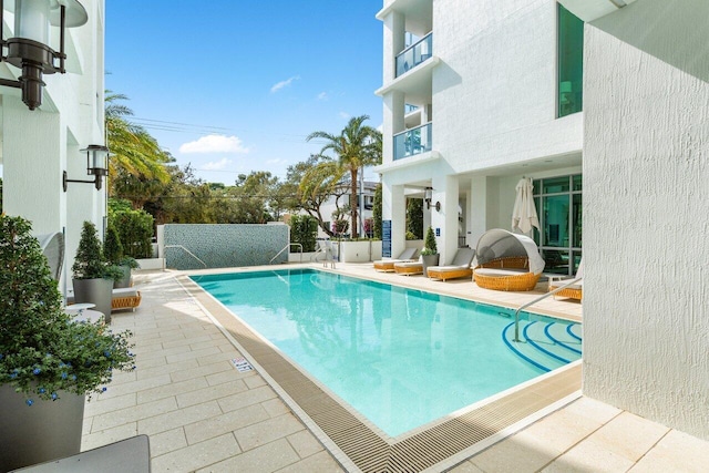 pool with a patio