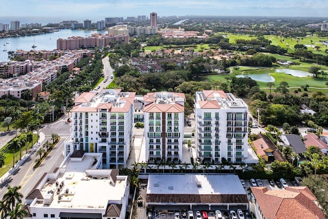 birds eye view of property featuring a water view and a city view