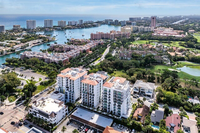 drone / aerial view featuring a water view and a view of city