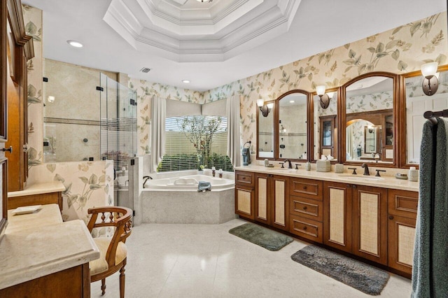 bathroom with shower with separate bathtub, ornamental molding, vanity, a raised ceiling, and tile patterned floors