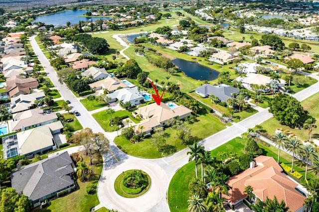 bird's eye view with a water view