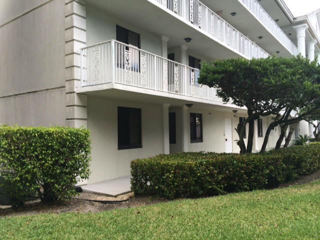 2461 Village Blvd Unit 101, West Palm Beach, FL 33409 - view of home's community featuring a lawn