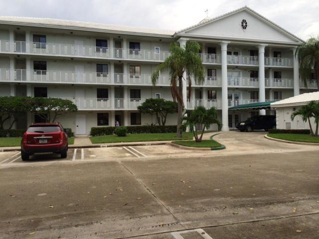 2461 Village Blvd Unit 101, West Palm Beach, FL 33409 - kitchen featuring black appliances, dark stone countertops, and backsplash