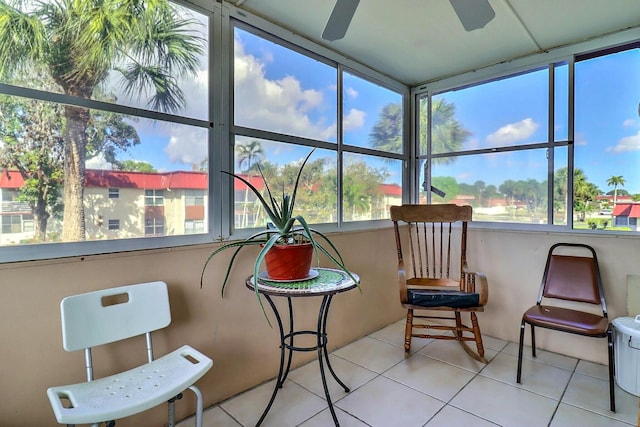 sunroom / solarium featuring ceiling fan