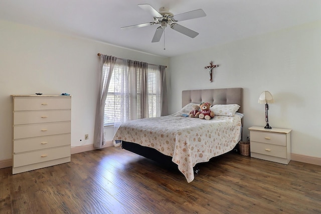 bedroom with dark hardwood / wood-style floors and ceiling fan